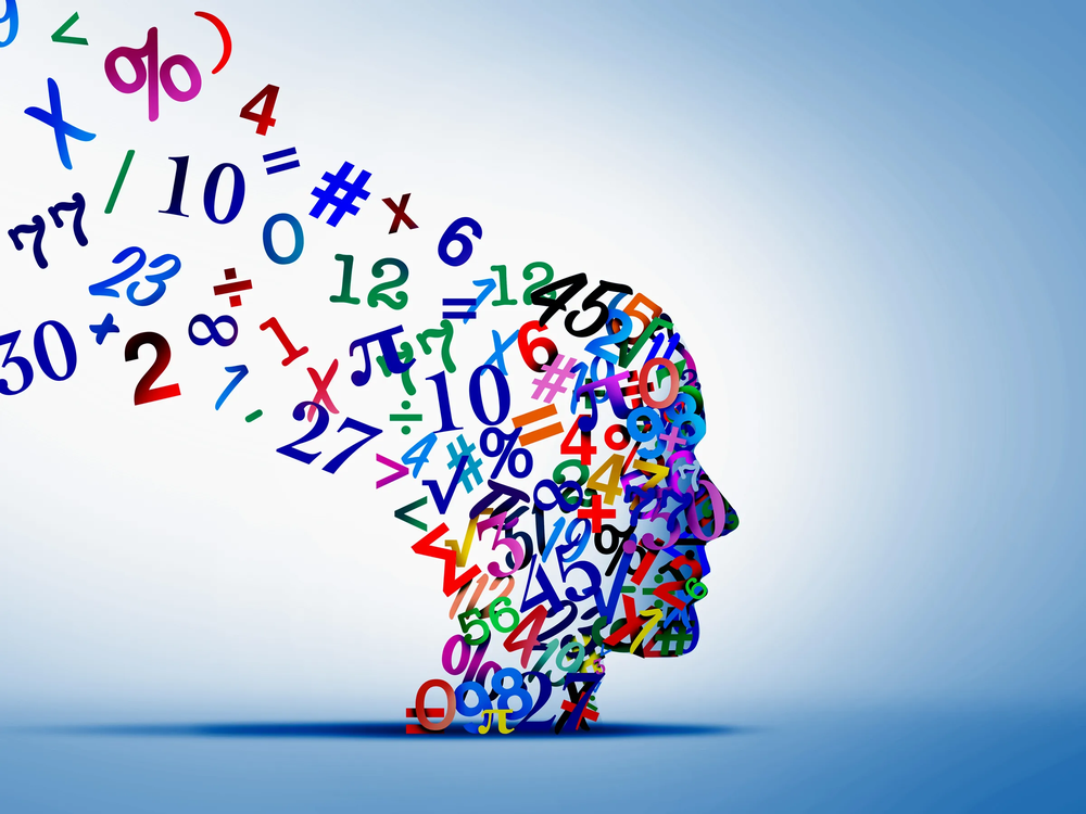 Profile of a human head made of colorful numbers and math symbols streaming out behind it