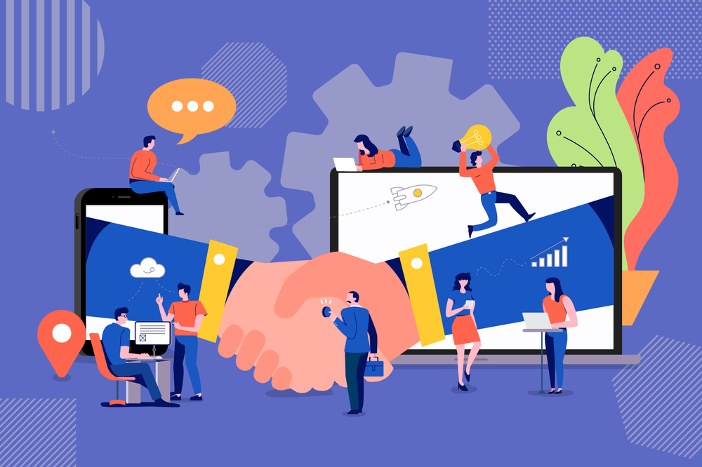 Two giant hands shake across a phone and laptop as small figures work, talk and share ideas around them