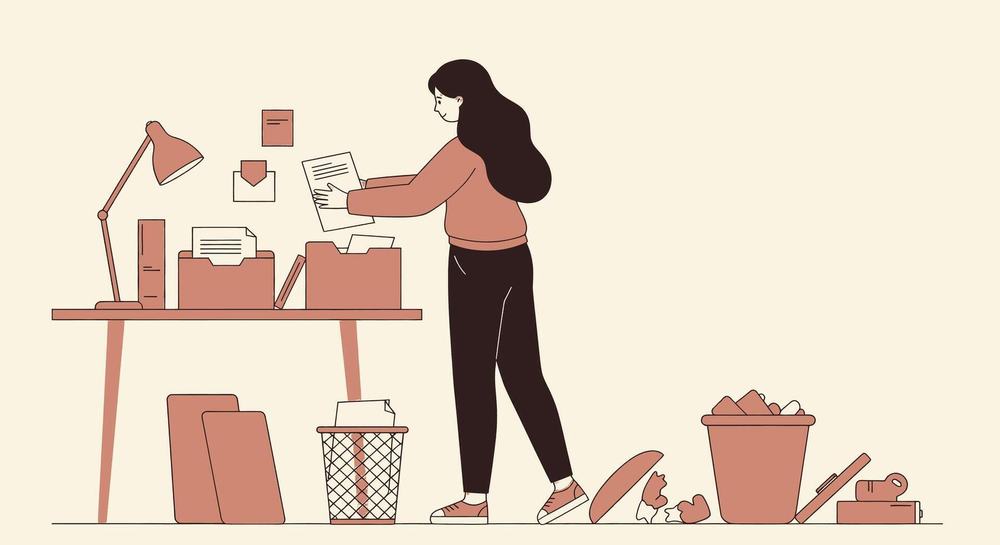 Illustration of a woman sorting papers into folders at her desk, with full trash bins nearby