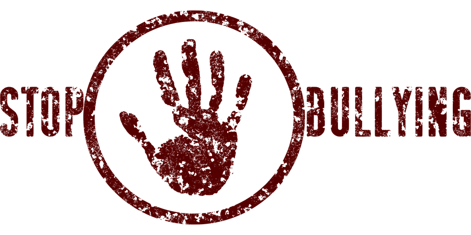 Stop Bullying stamp in dark red around a raised open handprint