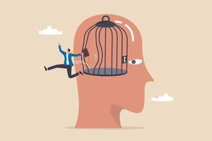 Illustration of a businessman leaping out of an open cage inside a giant head