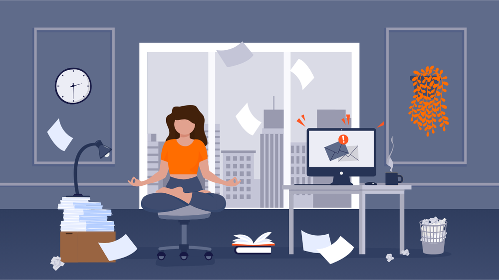 A woman meditating at her desk in a calm office as papers fly around her