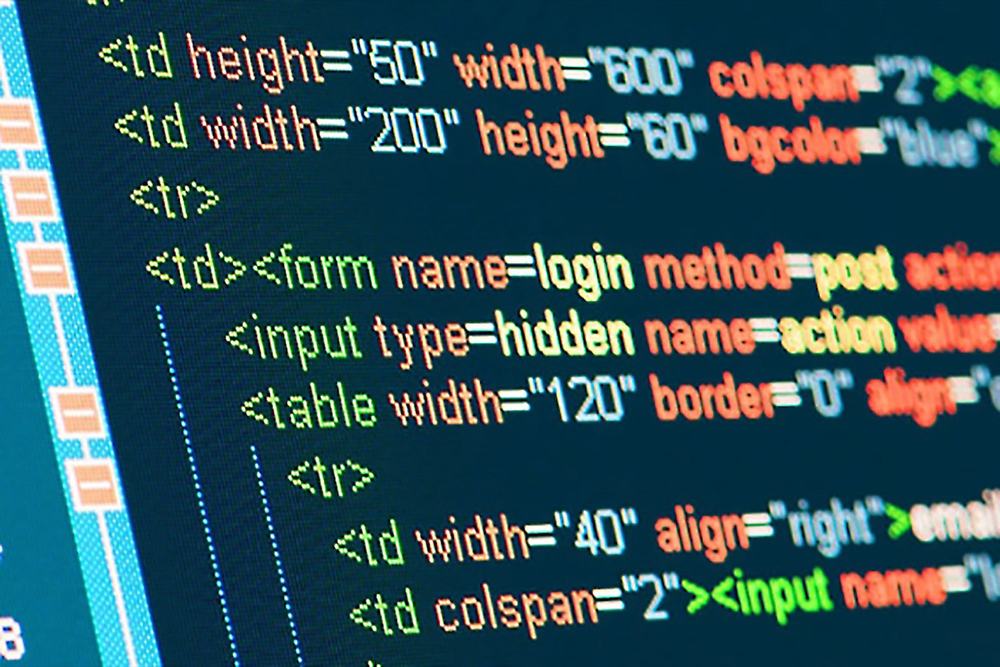 Close-up of colorful HTML source code with table, form and input tags on a screen