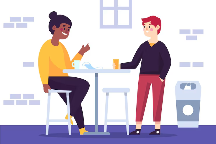 Illustration of two coworkers chatting at a high table in a break room, a cup and face mask on the table
