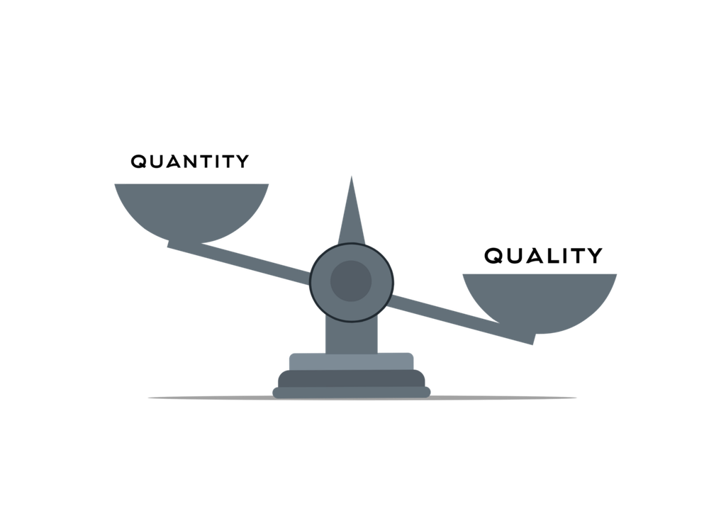 Balance scale tipped toward quality, with quantity on the lighter, raised side
